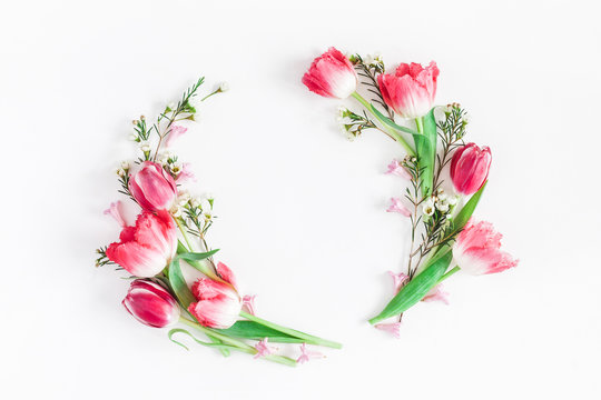 Flowers composition. Wreath made of pink tulip flowers on white background. Flat lay, top view, copy space