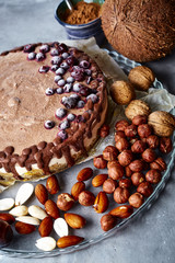 Chocolate vegan cake with different nuts, dates and carob