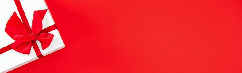 Valentine's day or wedding gift box on red banner background