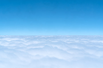 blue skyline and cloudscape, view of the airplane window