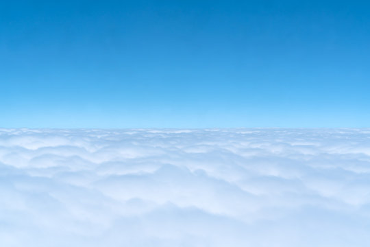 blue skyline and cloudscape, view of the airplane window
