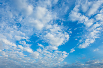 Naklejka na ściany i meble Beautiful fluffy clouds with blue sky background.