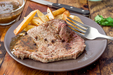 grilled beef steak with chips