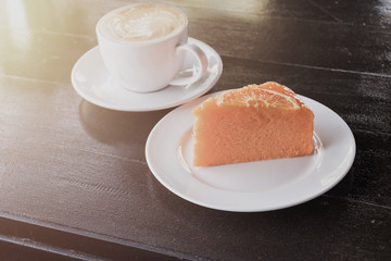 A cup of cafe latte and cake