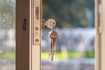 Key in door lock with blurry background