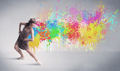 Naklejka na ściany i meble Young colorful street dancer with paint splash