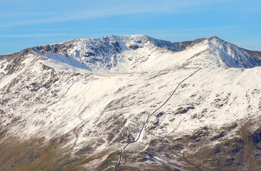 Snow covered mountains of Helvellyn, Striding Edge and Swirral Edge in the Lake District, England, UK.