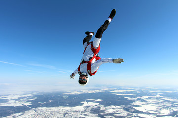 Skydiver is flying head down position.