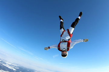 Fototapeta na wymiar Skydiver is flying head down position.