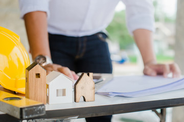 Business industrial ,Engineer and Architect concept, Engineer Architects office team working with blueprints and house model