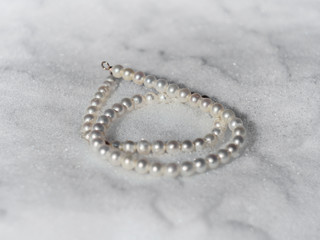 Pearl necklace on a snow