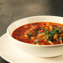 Tomato soup with red beans, potato and carrot. Vegan diet. European cuisine. Vegetarian dish. Main course. Organic meal. Toned photo.