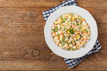 Traditional salad with cooked vegetables with mayonnaise.