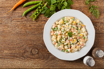 Traditional salad with cooked vegetables with mayonnaise.
