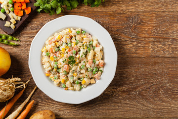 Traditional salad with cooked vegetables with mayonnaise. © gkrphoto