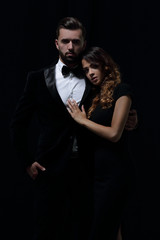 portrait of fashion couple on black background
