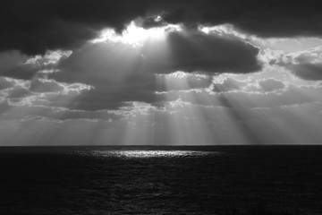 Obraz na płótnie Canvas Sunshine pouring over the sea