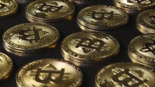 Gold coins crypto currency Bitcoin Ethereum Lietekoin Ripple on a dark background video on the move