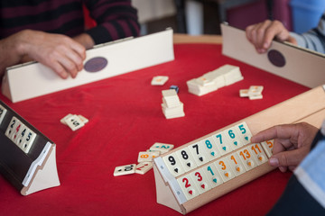 People play  popular logic table game rummikub