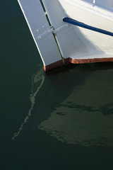 Part of white boat in the sea.