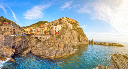 Fototapeta premium Beautiful colorful summer landscape-panorama on the coast of Manarola in Cinque Terre, Liguria, Italy, Europe in sunlight