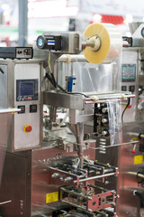 Automatic packing machine with plastic bag and paper box
