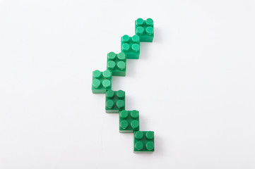 Fototapeta premium figures from a colored cubes designer on a white background