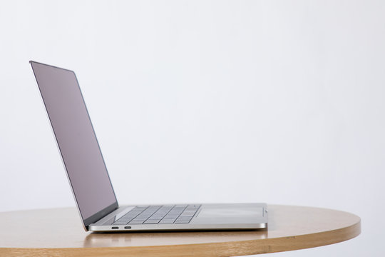 Modern computer,Modern laptop with blank screen on wood table