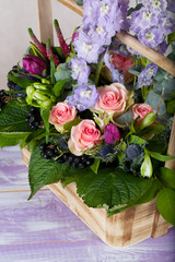 Woodenmade basket with beautiful flowers.