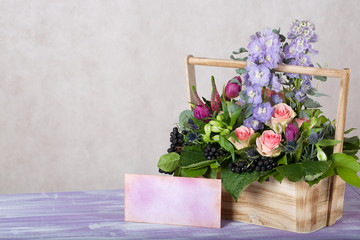 Woodenmade basket with beautiful flowers.