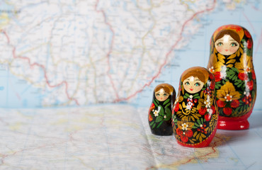Russian matryoshka in khokhloma style on a map. Closeup