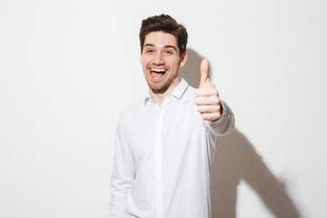 Portrait of a happy young man dressed in shirt