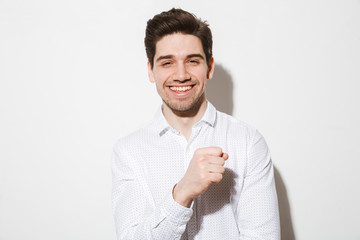 Portrait of a smiling young man dressed in shirt