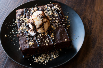 Chocolate Brownie with Ice Cream and Hazelnut Powder.