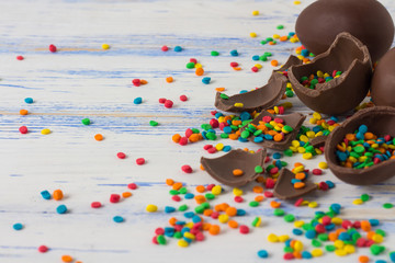 Easter Chocolate Eggs, Multicolored Sweets on the Old White Wooden Background. Easter concept