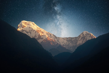 Night landscape on early morning. Starry sky with over the mountains
