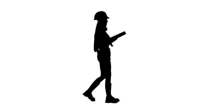 Engeneer girl in the helmet with construction tools on the waist goes . Silhouette. White background . Side view