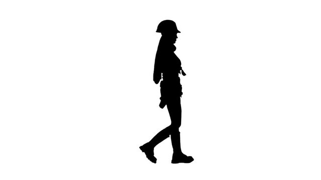 Engeneer girl in a helmet and with headphones on her neck goes . Silhouette. White background . Side view