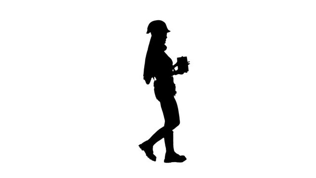 Engeneer girl carries a brick . Silhouette. White background . Side view