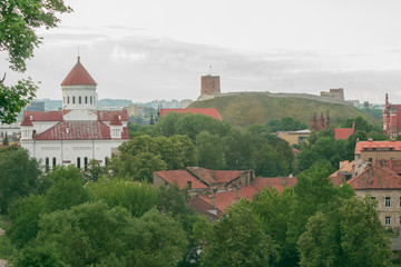 Panorama of summer Vilnius Old Town with Cathedral of the Theotokos, Gediminas Tower and Church of St. Anne in Lithuania