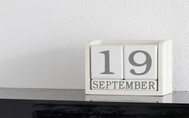 White block calendar present date 19 and month September