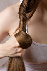 Naklejka premium Long hair of a young lady.