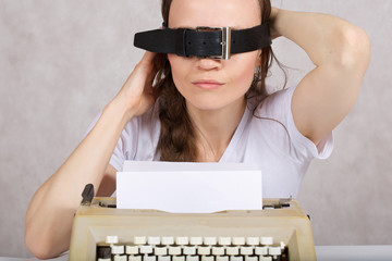 Young lady  with typing machine. Closeup