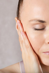 Ear of a young caucasian lady. Closeup
