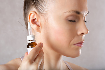 Ear of a young caucasian lady. Closeup
