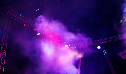 Color searchlight at a concert at night