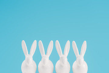 white easter rabbits isolated on blue