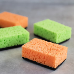 Household cleaning sponges for cleaning on gray  background.