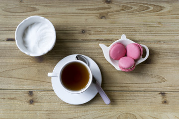 cap of tea and macaroons