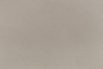 surface of brown cement wall.